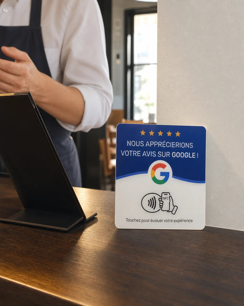 Vertical 4:5 commercial documentary photograph of the exact sourced NFC review plaque placed upright